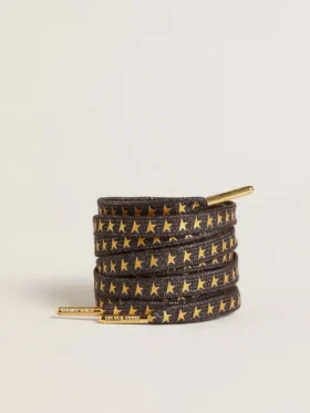 Cordones de lurex gris oscuro con estrellas doradas en contraste