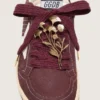 Cordones de pieles CNY de lana burdeos con broche de flor dorado