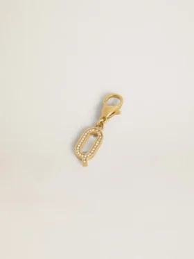Dije con la letra Q en latón dorado con cristales