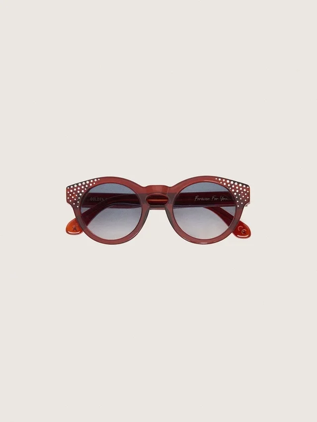 Gafas de sol Cameron Panthos con montura color miel, piedras preciosas y lentes azules