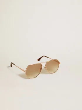 Gafas de sol estilo aviador con montura en oro rosa y lentes color miel