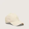 Gorra de béisbol de color crudo con una estrella bordada tono sobre tono
