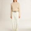 Jersey beige de mujer con la inscripción «Golden» en la espalda