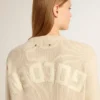 Jersey beige de mujer con la inscripción «Golden» en la espalda