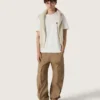 Jersey unisex de cuello redondo de algodón beige con parche en la parte delantera y logotipo en la espalda