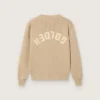 Jersey unisex de punto acanalado en color beige dorado para niños con logotipo en la espalda