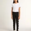 Leggings negros para niñas con estrellas blancas en los laterales