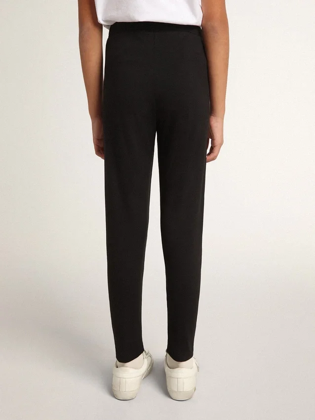 Leggings negros para niñas con estrellas blancas en los laterales