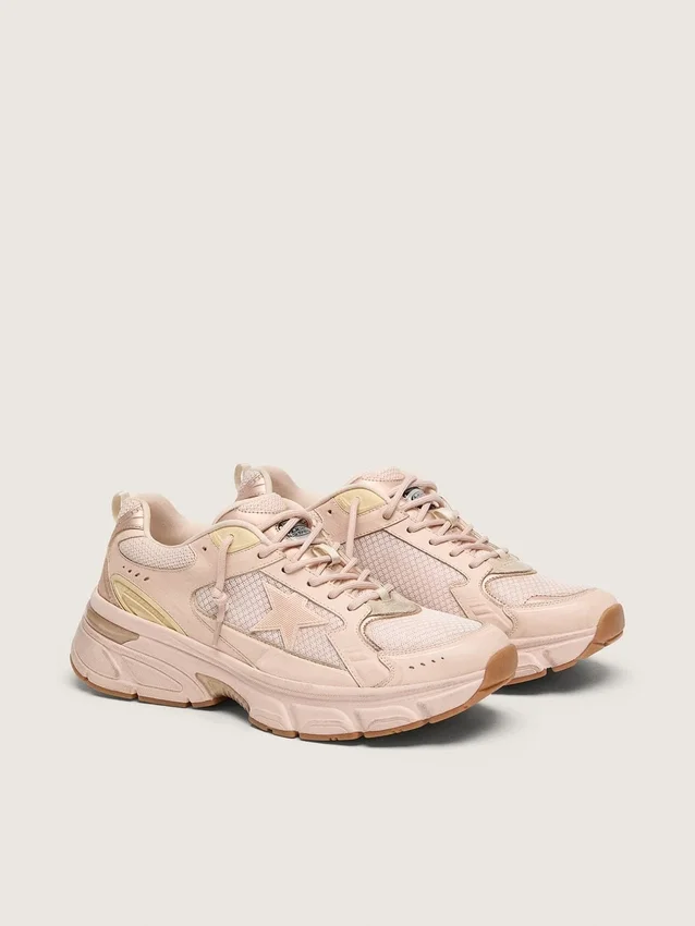Lightstar para mujer con parte superior de piel rosa y malla y estrella rosa