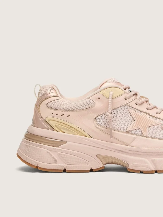 Lightstar para mujer con parte superior de piel rosa y malla y estrella rosa