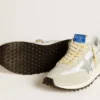Marathon para hombre con parte superior de nailon blanco y estrella plateada