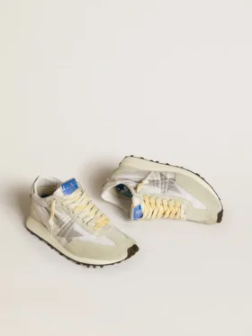 Marathon para mujer con parte superior de nailon blanco y estrella plateada
