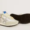 Marathon para mujer con parte superior de nailon blanco y estrella plateada