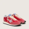Marathon para mujer con parte superior de nailon rojo y estrella plateada
