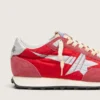 Marathon para mujer con parte superior de nailon rojo y estrella plateada