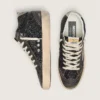 Mid Star para mujer en negro brillante con estrella y lengüeta del talón de ante gris paloma