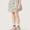 Minifalda para niñas «Journey» de lona de algodón blanca con estampado floral verde