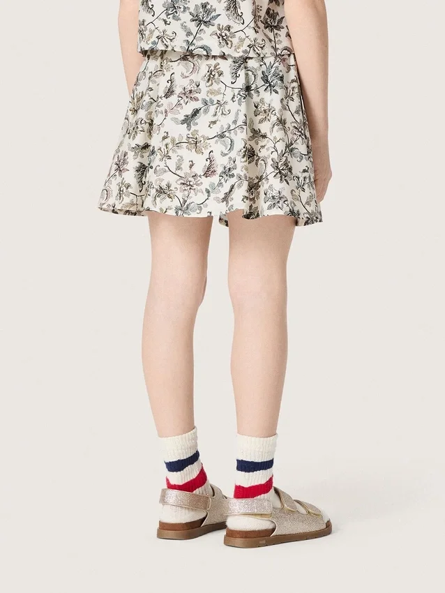 Minifalda para niñas «Journey» de lona de algodón blanca con estampado floral verde