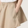 Minifalda para niñas «Journey» en gabardina de algodón beige con estampado