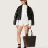 Camisas oversize de mujer en algodón blanco con detalle plisado y botones de joyería