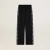 Pantalones de chándal negros de mujer con estrellas blancas en los laterales