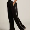 Pantalones de chándal negros de mujer con estrellas blancas en los laterales