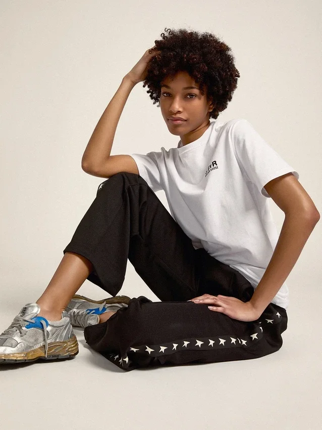 Pantalones de chándal negros de mujer con estrellas blancas en los laterales