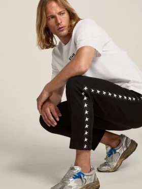 Pantalones de chándal negros para hombre con estrellas blancas en los laterales
