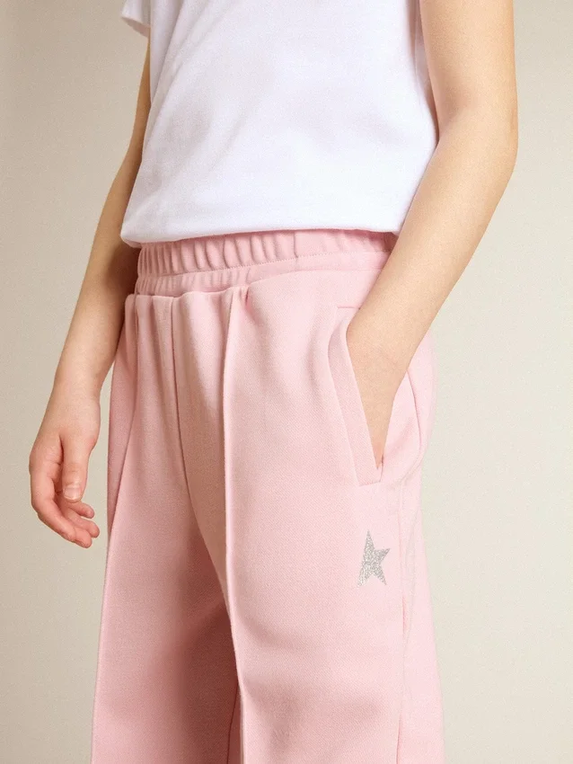 Pantalones de chándal rosas con una estrella brillante en la parte delantera