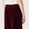 Pantalones de efecto terciopelo burdeos para niñas con bolsillo trasero