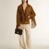 Pantalones de encaje transparente de color crema para mujer