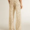 Pantalones de encaje transparente de color crema para mujer