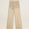 Pantalones de encaje transparente de color crema para mujer