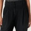 Pantalones de mujer de denim de algodón negro con acabado desgastado