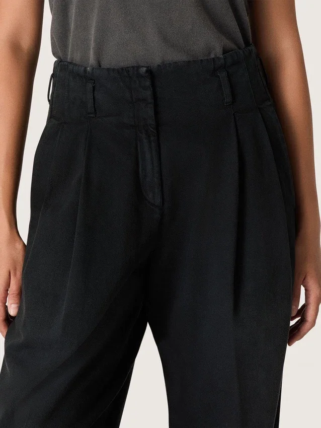Pantalones de mujer de denim de algodón negro con acabado desgastado