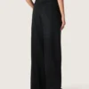 Pantalones de mujer de denim de algodón negro con acabado desgastado