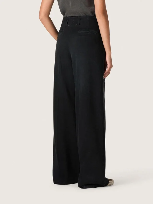 Pantalones de mujer de denim de algodón negro con acabado desgastado
