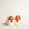 Purestar para hombre con estrella de piel blanca y lengüeta del talón naranja