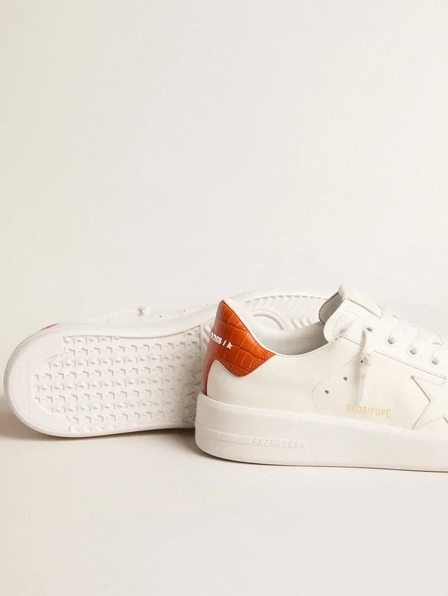 Purestar para mujer con estrella de piel blanca y lengüeta naranja en el talón