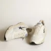 Running Sole de piel blanca y malla con estrella de piel laminada azul
