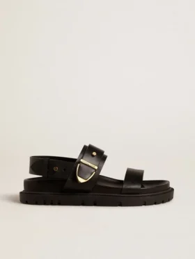 Sandalia Lucy para mujer en piel negra brillante con hebilla metálica dorada