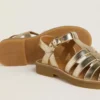 Sandalias Maxime Young en piel dorada