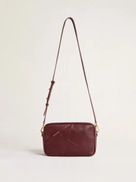 Star Bag de piel color vino con estrella tono sobre tono