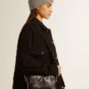Star Bag en piel negra brillante con estrella tono sobre tono
