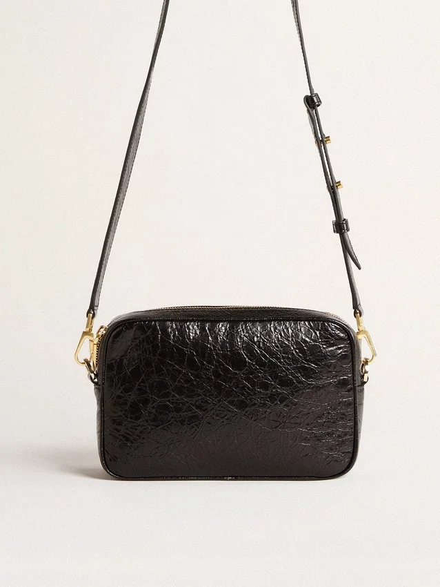 Star Bag en piel negra brillante con estrella tono sobre tono