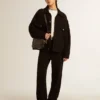 Star Bag en piel negra brillante con estrella tono sobre tono