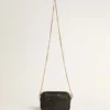 Star Bag Mini de piel negra con estrella tono sobre tono