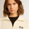 Sudadera blanca con cremallera para mujer, con raya blanca y estrellas negras