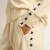 Sudadera blanca con cremallera para mujer, con raya blanca y estrellas negras
