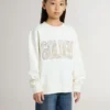 Sudadera blanca para niñas con letras doradas multicolores en la parte delantera